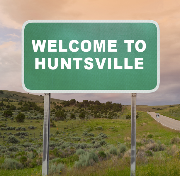 Image of sign on country road that reads Welcome To Huntsville.